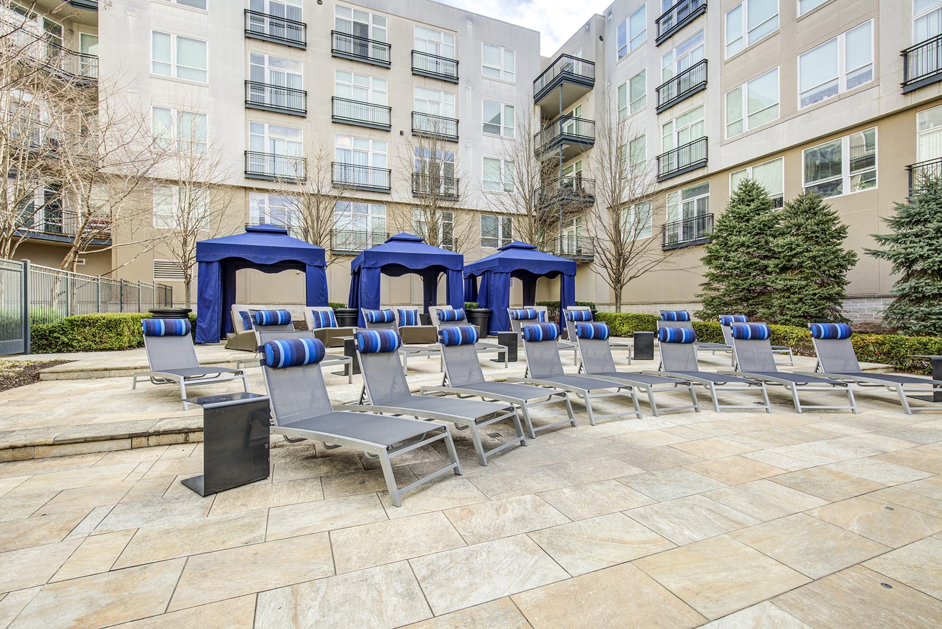 Private cabanas and lounge chairs in pool